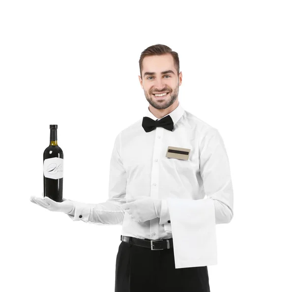Camarero guapo con botella de vino sobre fondo blanco — Foto de Stock