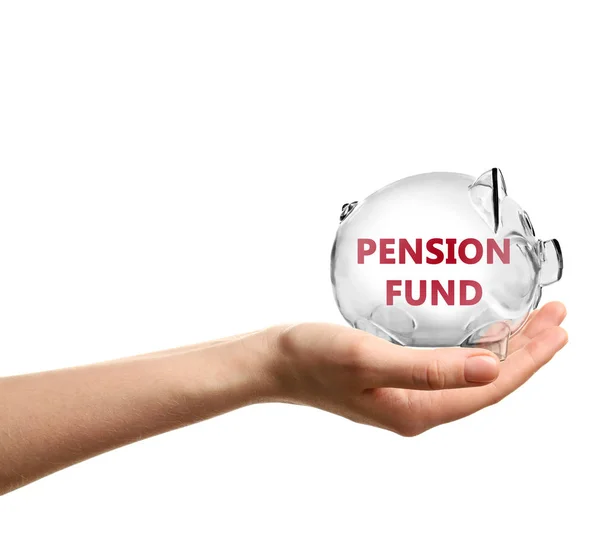 Woman holding piggy bank with text PENSION FUND on white background — Stock Photo, Image