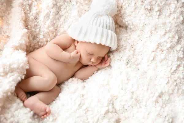 Cute newborn baby girl lying on plaid — Stock Photo, Image