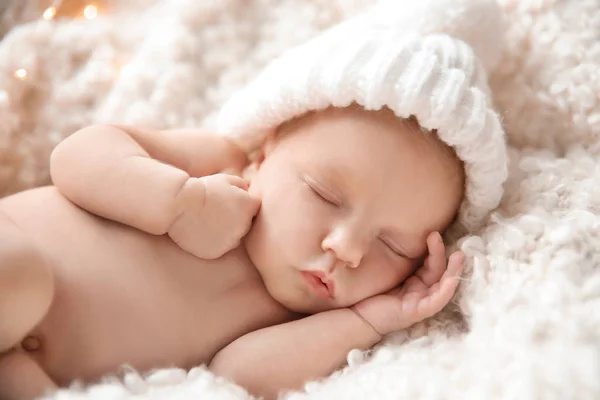 Cute newborn baby girl lying on plaid — Stock Photo, Image