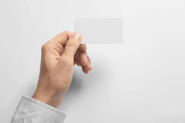 Man Holding Blank Business Card White Background Mock Design — Stock Photo, Image