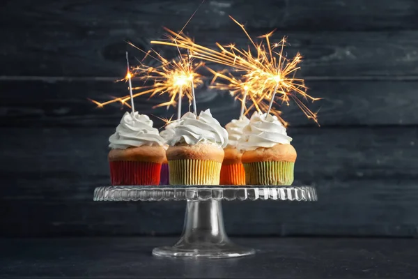 Birthday cupcakes with sparklers on stand — Stock Photo, Image