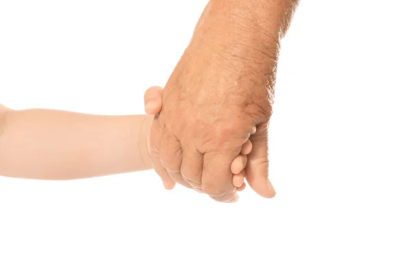 Mãos de homem idoso e bebê sobre fundo branco — Fotografia de Stock