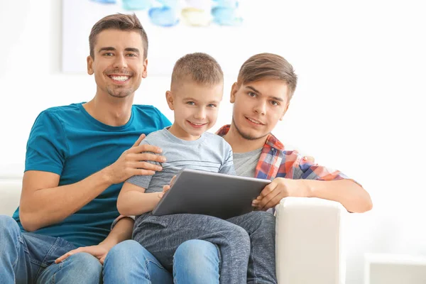 Male Gay Couple Adopted Boy Tablet Home — Stock Photo, Image