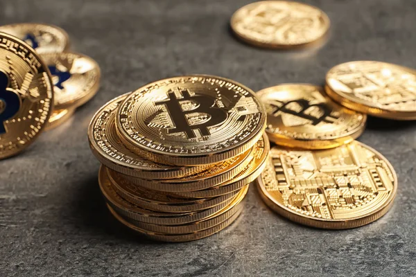 Golden bitcoins on grey — Stock Photo, Image