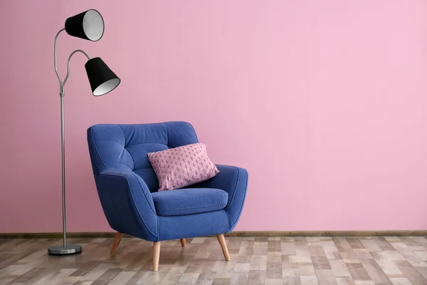 Soft armchair and floor lamp
