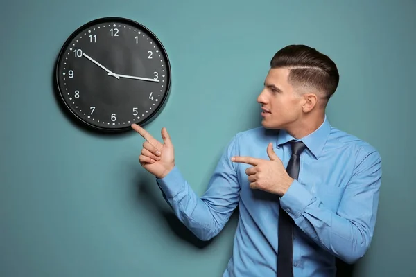 Handsome Manager Looking Clock Hanging Wall — Stock Photo, Image
