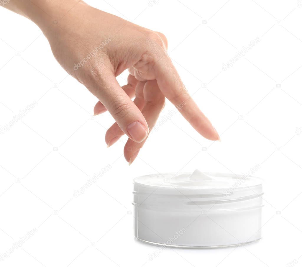 Female hand with jar of cream on white background