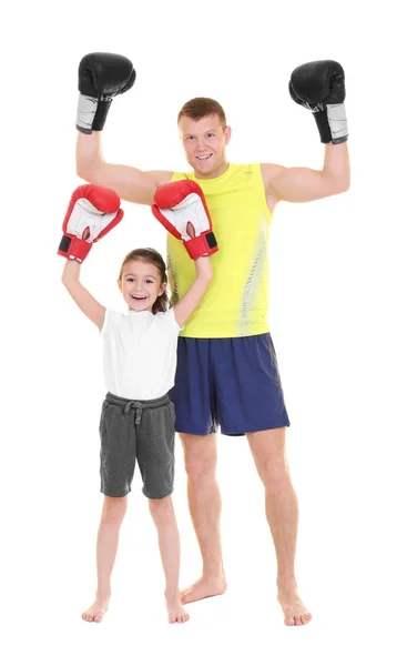 Söt liten flicka med boxning tränare på vit bakgrund — Stockfoto