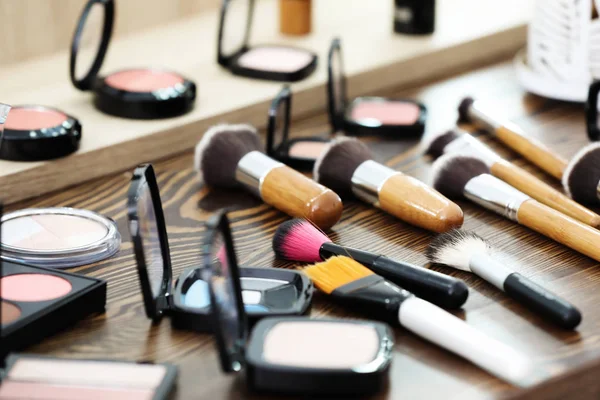 stock image Decorative cosmetics and tools of professional makeup artist on dressing table