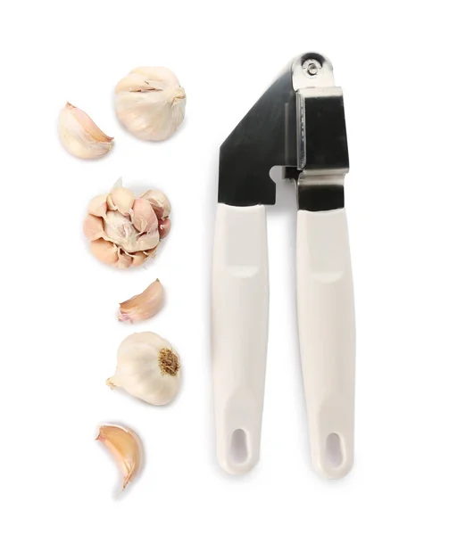 Press and garlic on white — Stock Photo, Image