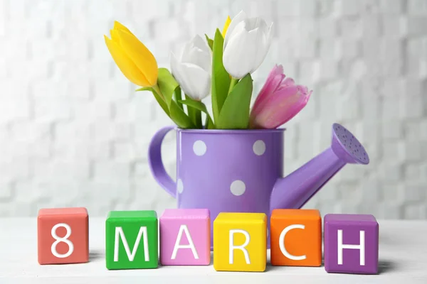 Watering Can Tulips Colorful Cubes Table — Stock Photo, Image