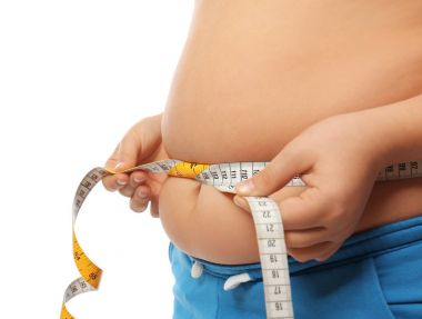 Overweight boy measuring waist   clipart