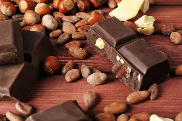 Chocolate, cocoa beans and butter — Stock Photo, Image