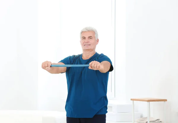 Senior man doing exercises — Stock Photo, Image