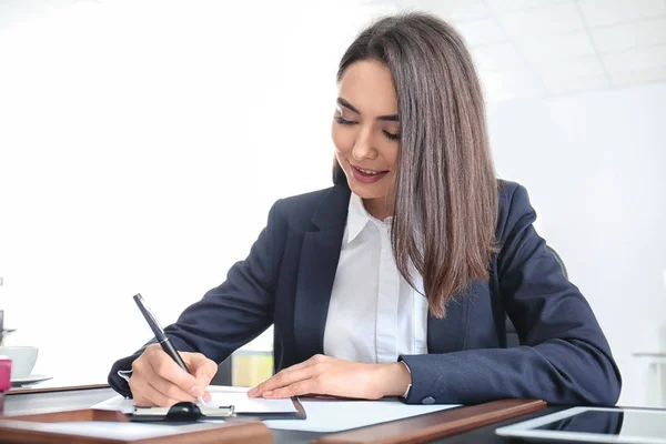 Attractive young lawyer in office