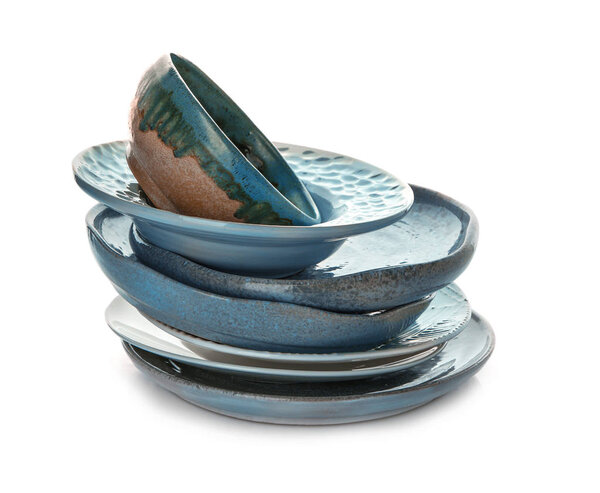Ceramic tableware on white background