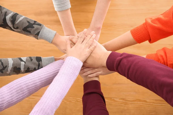 Teenagers Putting Hands Together Table Royalty Free Stock Photos