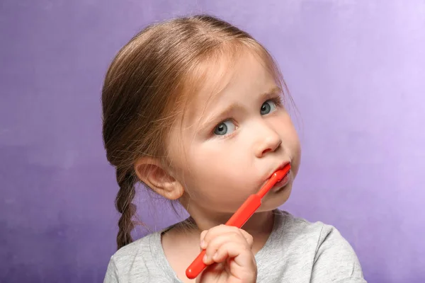 Cute Little Girl Brushing Teeth Color Background — Stock Photo, Image