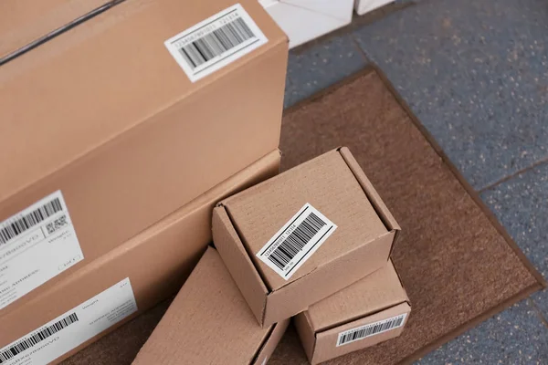 Delivered parcels on doormat, closeup