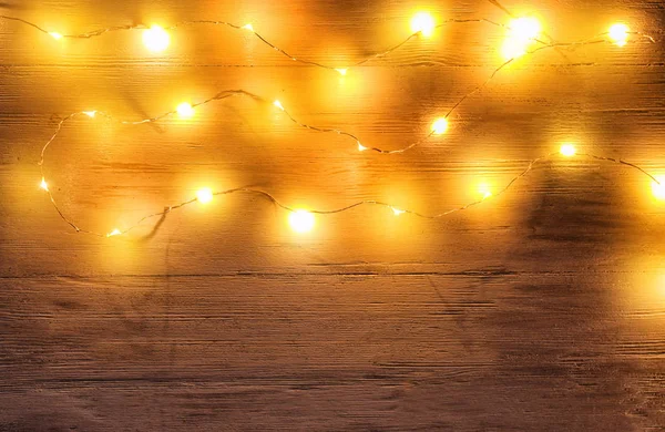 Glowing Christmas Lights Wooden Background — Stock Photo, Image