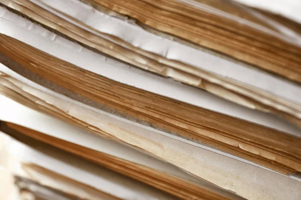 Stack of old documents in archive, closeup