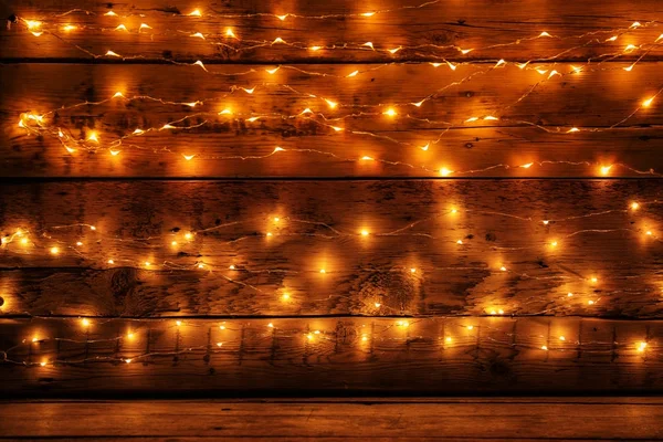 Ahşap Arka Plan Üzerinde Neşeli Noel Işıkları — Stok fotoğraf