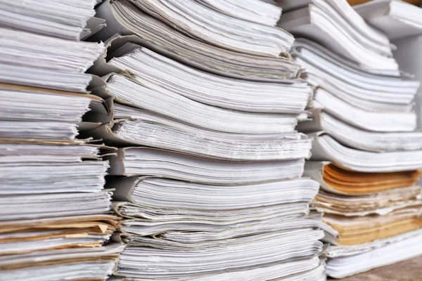 Stacks of old paper documents in archive, closeup