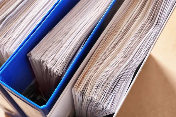 Folders with old paper documents in archive, closeup