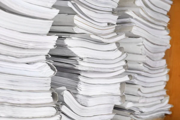 Stacks of old paper documents in archive