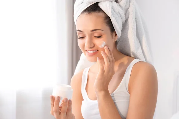 Attractive Young Woman Applying Face Cream Home — Stock Photo, Image