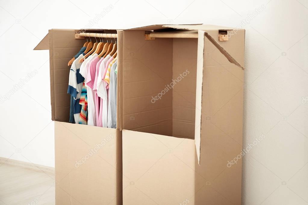 Wardrobe boxes with clothes indoors