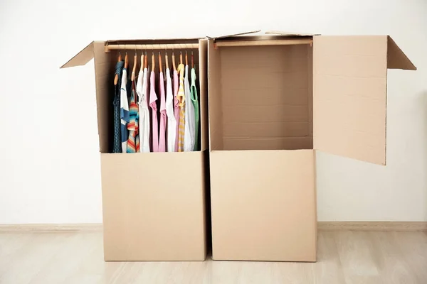 Wardrobe boxes with clothes indoors