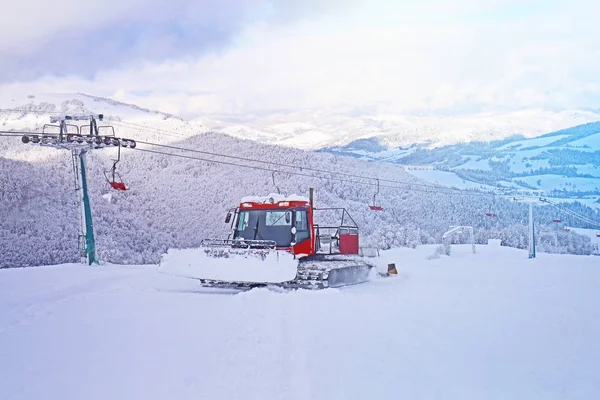 Snowplow machine at ski mountain resort
