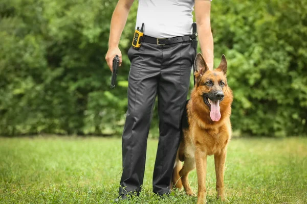 Security guard with dog in park