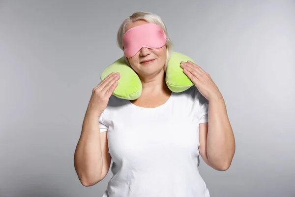 Senior Woman Travel Pillow Sleep Mask Grey Background — Stock Photo, Image