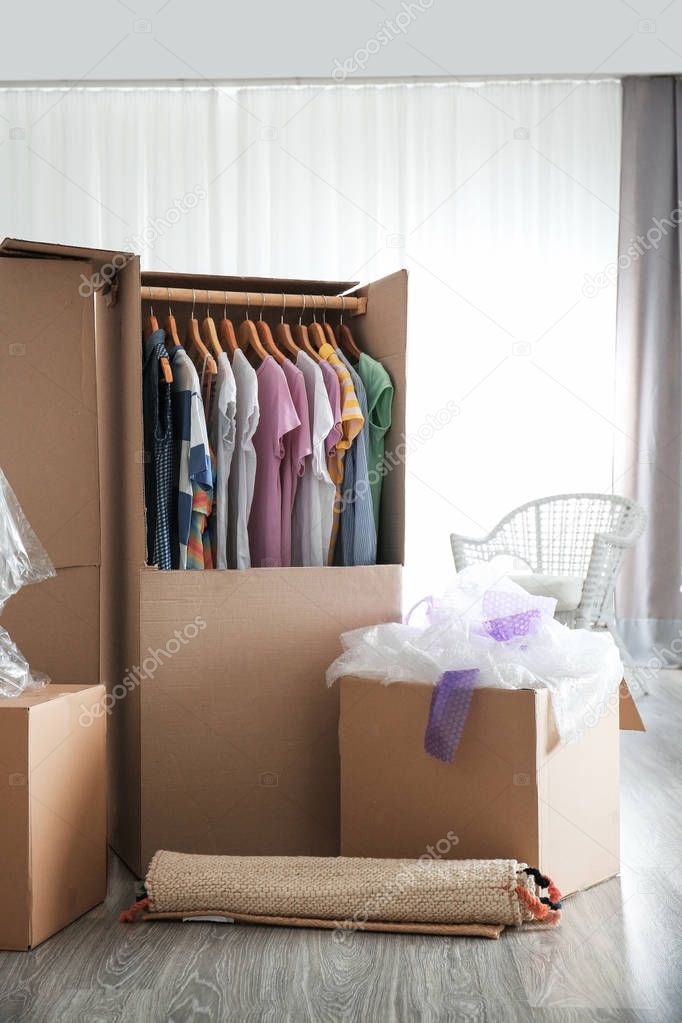 Wardrobe boxes with clothes indoors