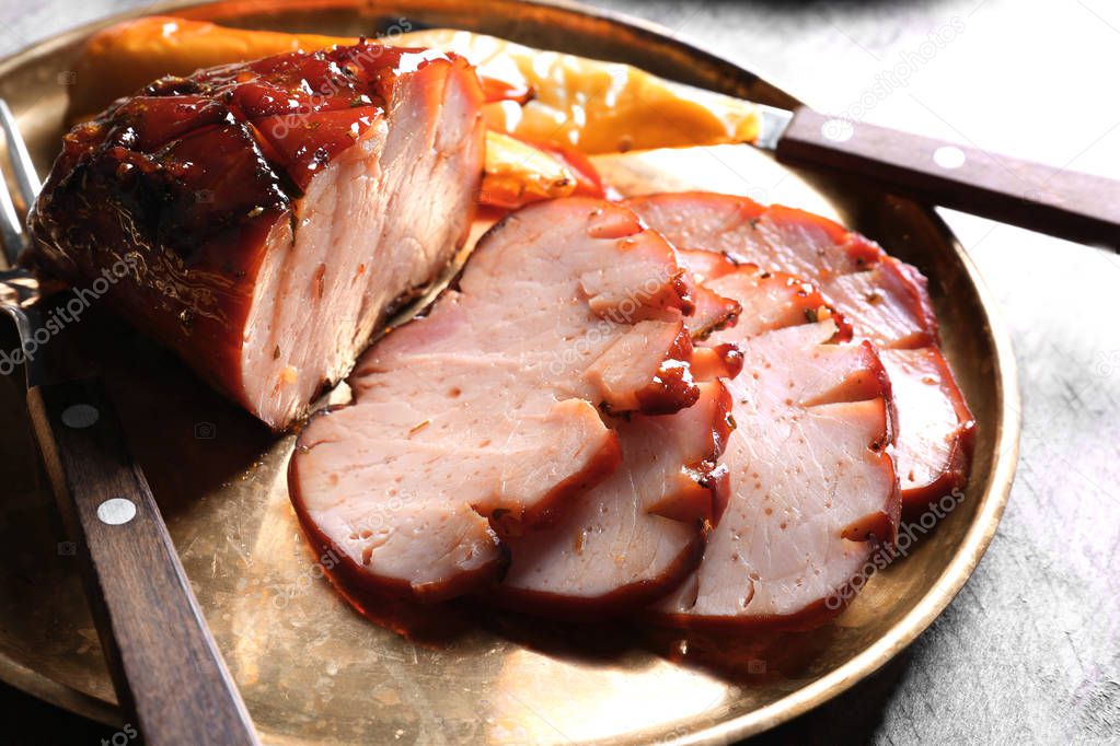 Plate with sliced honey baked ham, closeup