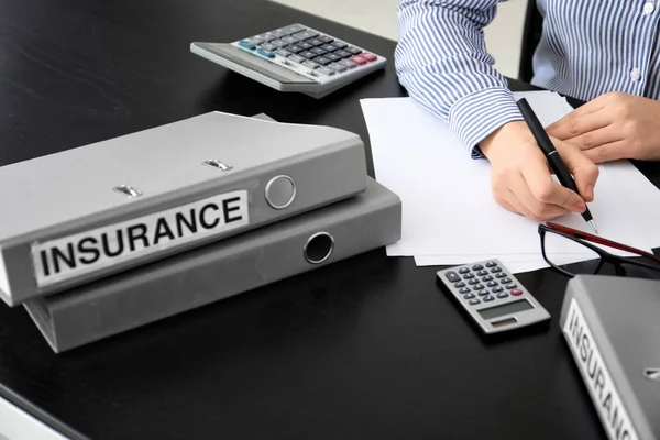 Female insurance agent at workplace — Stock Photo, Image