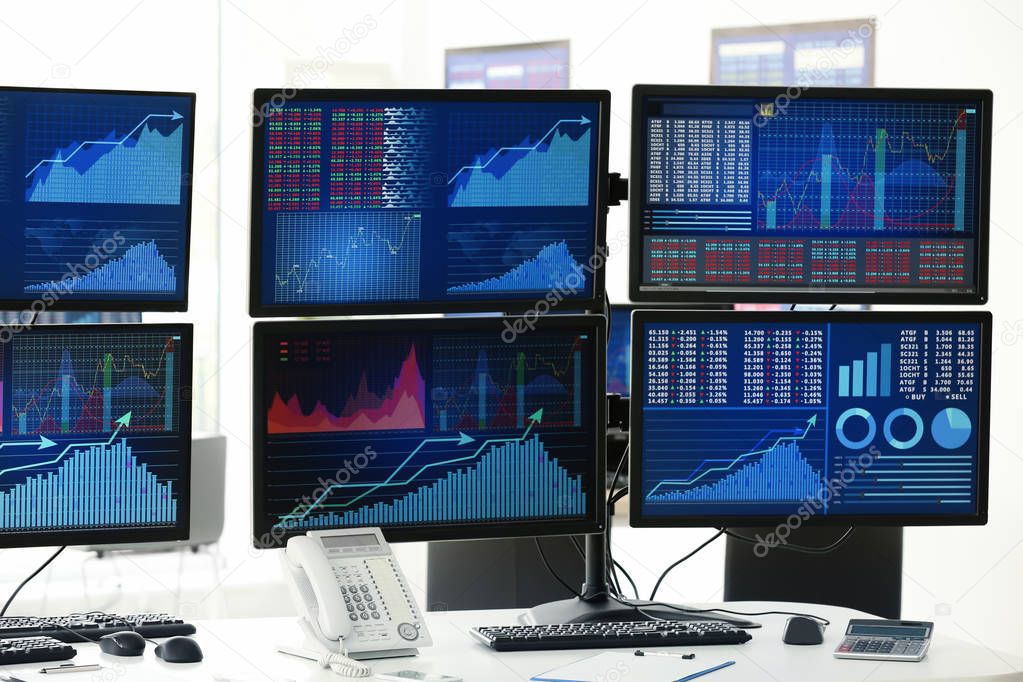 Modern stock traders workplace in office