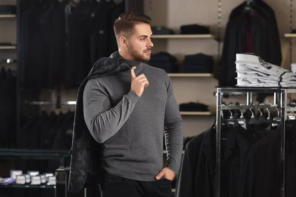 Young man in stylish clothes at menswear store — Stock Photo, Image