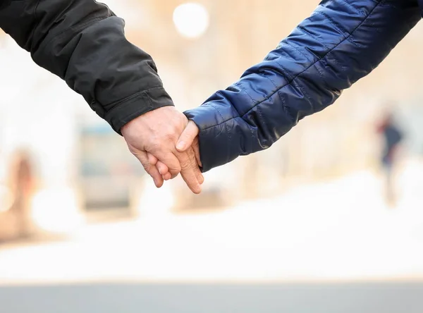 Happy mature couple holding hands outdoors, closeup — Stock Photo, Image