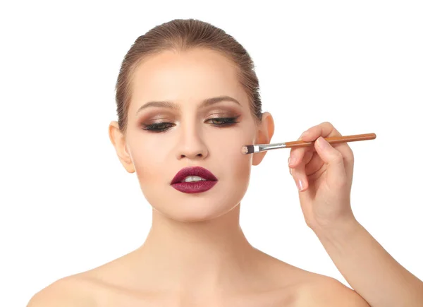 Visage artist applying makeup on face — Stock Photo, Image