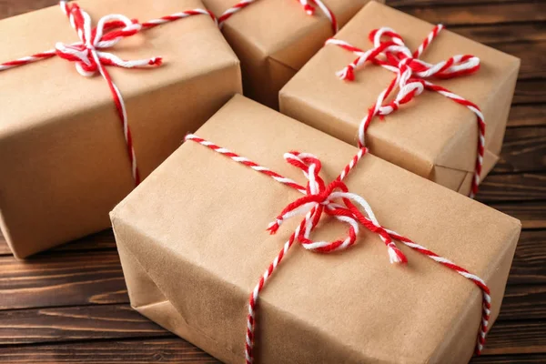 Parcel gift boxes on wooden table, closeup — Stock Photo, Image