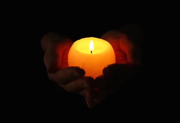 Woman holding burning candle — Stock Photo, Image