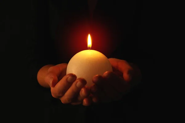 Woman holding burning candle — Stock Photo, Image