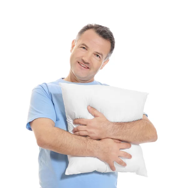Mature man with soft pillow on white background — Stock Photo, Image