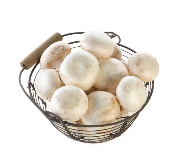 Cesta com cogumelos champignon no fundo branco — Fotografia de Stock