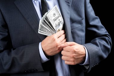 Banknot cebinde, closeup koyarak iş adamı. Yolsuzluk kavramı