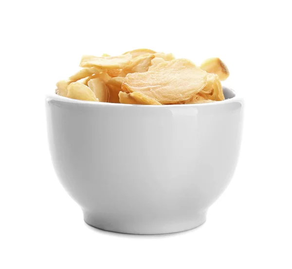 Dried garlic flakes in bowl on white background — Stock Photo, Image